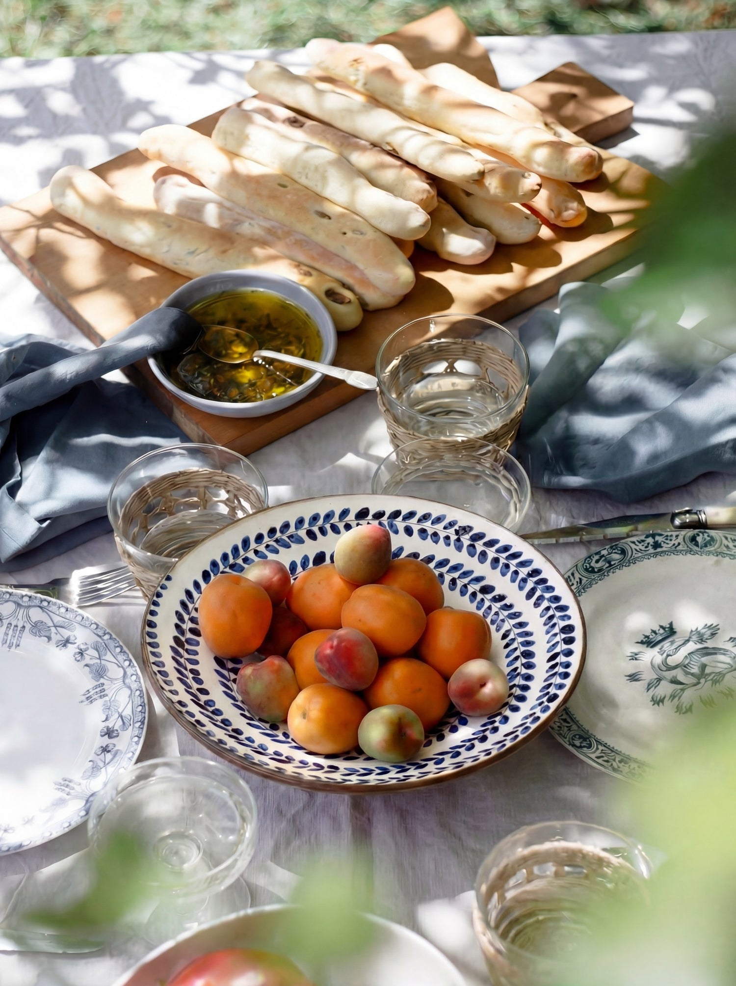 For the Table — Fayoum ceramics on a dressed outdoor dining table