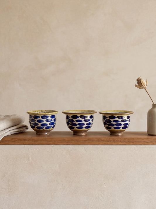 Fayoum pottery Hand-Painted Fayoum Pottery Bowl: Egyptian Ceramic Mezze Dish, Yellow Rim Blue Dot Design - front view
